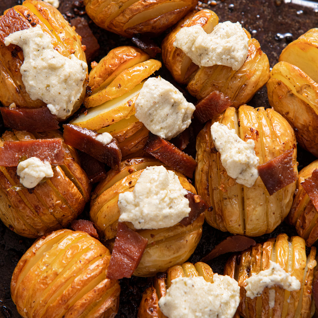 Hasselback Potatoes with Garlic & Herb Vegan Cheese
