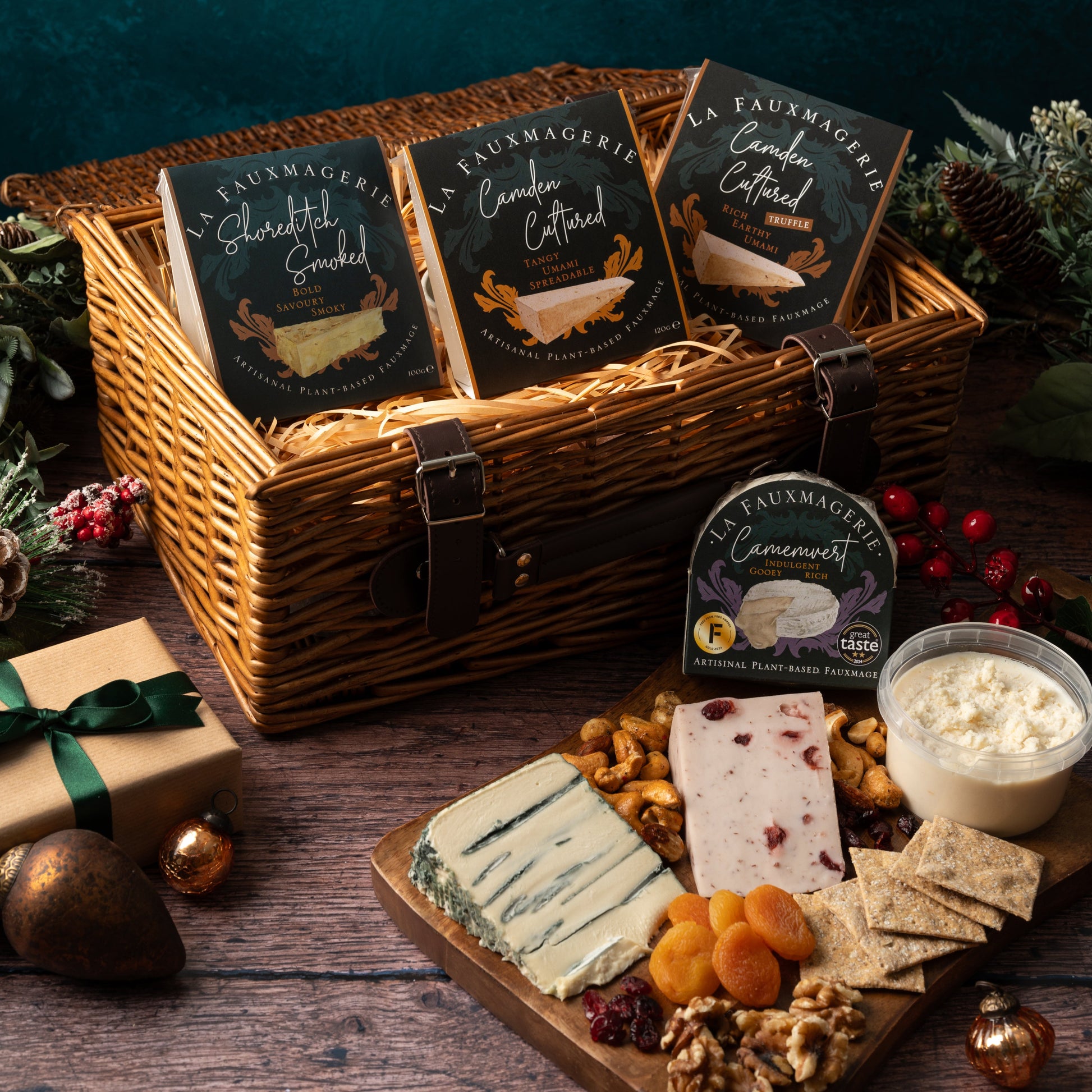 Wicker basket with cheese platter and La Fromagerie cheese packaging on a wooden surface.